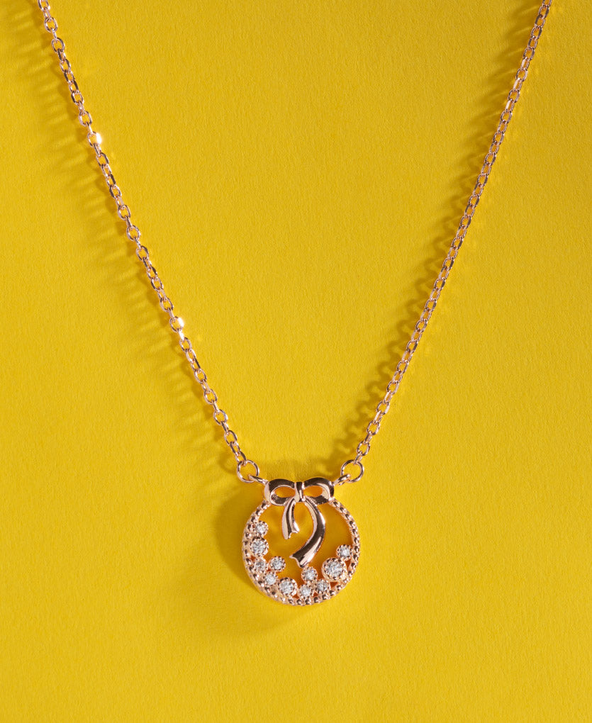 Sparkling Silver Bow Necklace With Studs With Rose Gold Finish